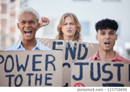 Angry, activism and activist group protest racism, oppression and human rights violation with poster. Diverse students, fist and rally together for unity and civil rights, justice and revolution. 123758698