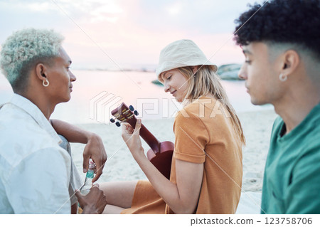 Young friends play music on beach, people on summer holiday and travel outdoor with guitar ukulele in Hawaii. Diversity students vacation together, relax at sea picnic and road trip celebration 123758706