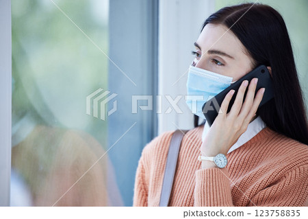 Covid, face mask and smartphone with woman on a phone call for healthcare, compliance and corona virus information in her home for safety. Sad business woman talking on cellphone for insurance policy Covid, face mask and smartphone with woman on a phone call for healthcare, compliance and corona virus information in her home for safety. Sad business woman talking on cellphone for insurance policy 123758835