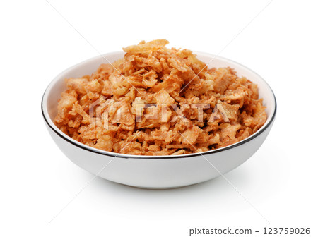 Ceramic bowl of dried onion flakes Ceramic bowl of dried onion flakes 123759026