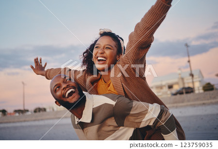 Freedom, love and happy with couple and piggy back ride together on outdoor date for support, sunset or lifestyle vacation. Smile, summer and airplane with man and woman on holiday for relax or faith 123759035