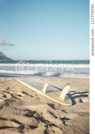 Beach, surfboard and sand in nature, summer aesthetic of Los angeles at sunset. Sport, freedom and adventure with waves in ocean to enjoy water sports, fun and stress relief in a tropical paradise 123759056