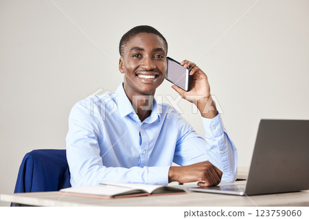 Businessman, smile and phone for call at desk with laptop for reading communication, email or report on the internet. Black man, happy and working in office with green screen phone in at table Businessman, smile and phone for call at desk with laptop for reading communication, email or report on the internet. Black man, happy and working in office with green screen phone in at table 123759060