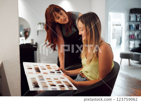 Salon small business hairdresser, color hair and consultation with client for trust, advice and professional care. Dye swatch portfolio hairstylist entrepreneur consulting with customer for startup 123759062