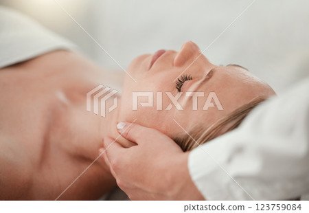 Spa, woman head massage and calm skincare treatment of a woman feeling relax and peace. Wellness, beauty and luxury facial for body relaxation and cosmetic dermatology using botox at a salon 123759084