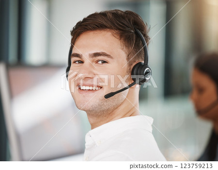 Portrait of a call center consultant working in an office doing a crm strategy with headset. Happy, professional and young telemarketing agent doing ecommerce sales and customer support operation. Portrait of a call center consultant working in an office doing a crm strategy with headset. Happy, professional and young telemarketing agent doing ecommerce sales and customer support operation. 123759213