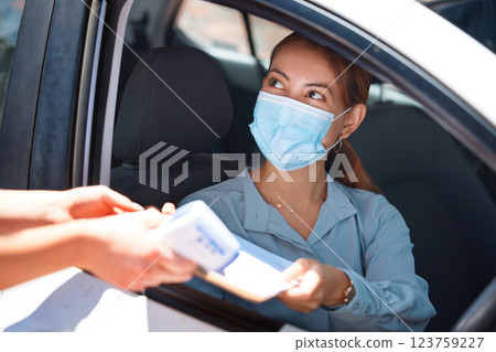 Car driver, face mask and document covid woman exam medical report for security, safety and corona virus protection. Paper form, girl worker and motor vehicle pass Covid 19 healthcare test questions 123759227