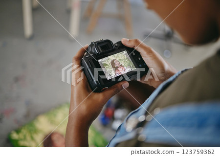 Hands, art painting and digital camera photograph for creative e commerce store, online shopping website and ecommerce sales. Zoom on indian woman, painter and designer photography of workshop canvas Hands, art painting and digital camera photograph for creative e commerce store, online shopping website and ecommerce sales. Zoom on indian woman, painter and designer photography of workshop canvas 123759362