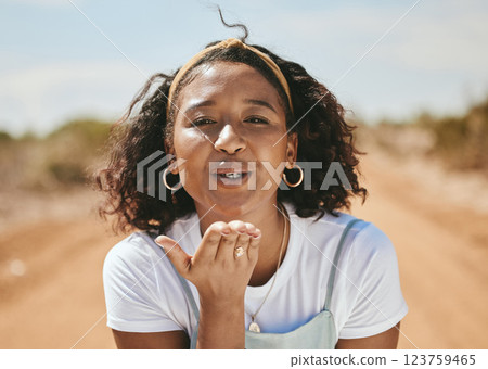 Happy woman, blowing kiss and portrait for love emoji, relax and flirting outdoors in Colombia. Young, smile and freedom gen z girl with expression of hand kisses, joy and summer happiness in nature Happy woman, blowing kiss and portrait for love emoji, relax and flirting outdoors in Colombia. Young, smile and freedom gen z girl with expression of hand kisses, joy and summer happiness in nature 123759465