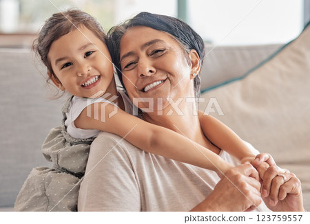 Girl, grandma and sofa smile for love in bonding time together in home on holiday. Grandmother, kid and living room care, happiness and time as family in happy moment on couch in living room Girl, grandma and sofa smile for love in bonding time together in home on holiday. Grandmother, kid and living room care, happiness and time as family in happy moment on couch in living room 123759557