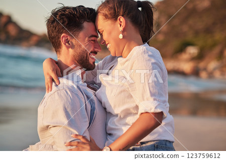 Couple, laughing or love hug on beach at sunset for anniversary event, honeymoon celebration or engagement. Smile, happy or comic man and woman bonding in summer by tropical ocean or sea in Portugal 123759612