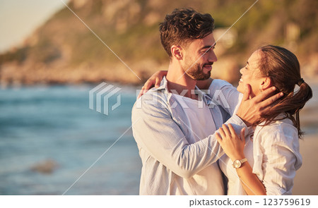 Love, beach and couple embrace at sunset for romantic summer evening date together in nature. Happy, sweet and satisfied people in relationship make eye contact for affection and care. 123759619