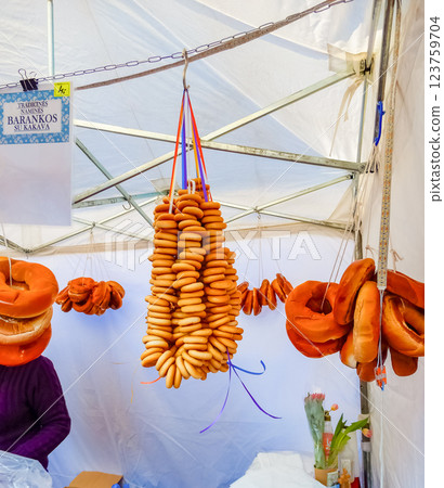 Traditional Lithuanian Barankos, bagels hanging at a street market food . High quality photo Traditional Lithuanian Barankos, bagels hanging at a street market food . High quality photo 123759704