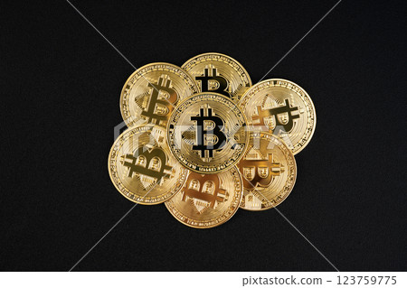 Heap of Golden Bitcoin on Black Leather Background. 123759775