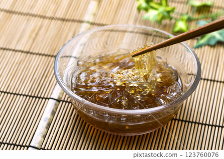 Tokoroten_Served in a glass bowl on a bamboo mat Tokoroten_Served in a glass bowl on a bamboo mat 123760076