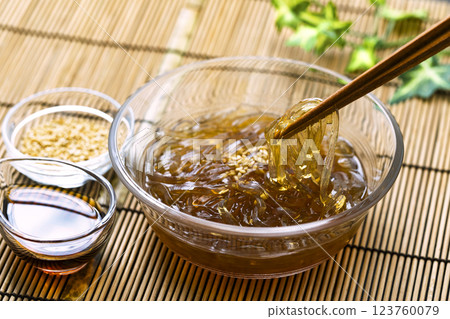 Tokoroten_Served in a glass bowl on a bamboo mat Tokoroten_Served in a glass bowl on a bamboo mat 123760079