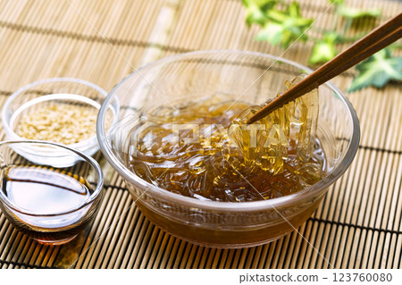 Tokoroten_Served in a glass bowl on a bamboo mat Tokoroten_Served in a glass bowl on a bamboo mat 123760080