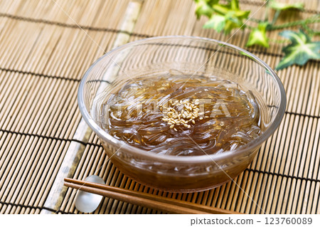 Tokoroten_Served in a glass bowl on a bamboo mat Tokoroten_Served in a glass bowl on a bamboo mat 123760089
