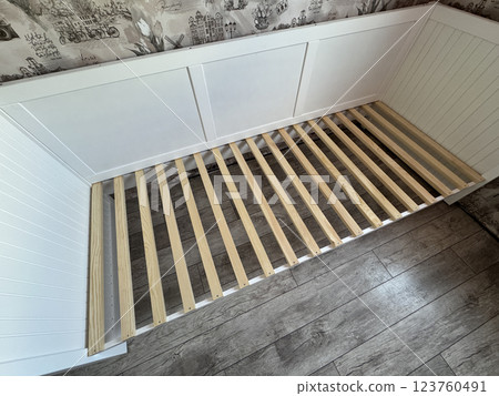 A set of elements for assembling an ottoman. A set of elements for assembling an ottoman. 123760491