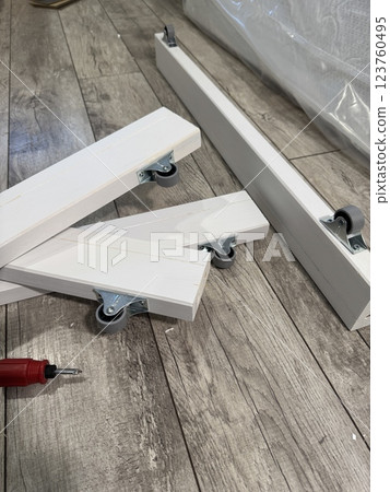 A set of elements for assembling an ottoman. 123760495