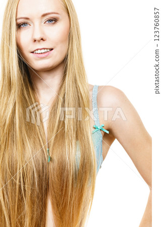 Woman in bra covering her breast by long hair Woman in bra covering her breast by long hair 123760857