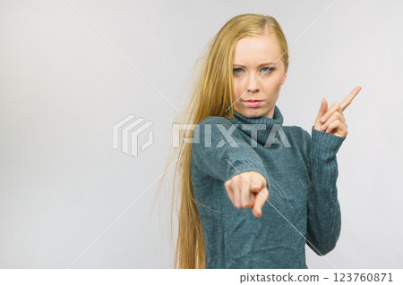Woman pointing and shaking her finger 123760871