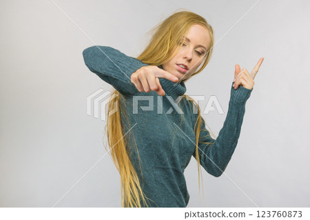 Woman pointing and shaking her finger 123760873