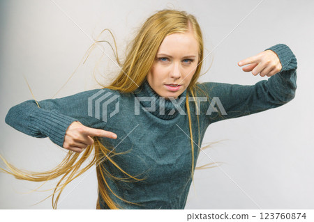 Angry female pointing with fingers 123760874