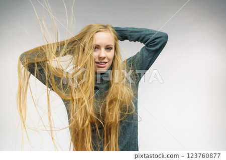 Girl with hair flying around her face 123760877