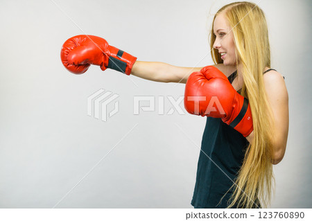 Woman in red gloves boxing Woman in red gloves boxing 123760890