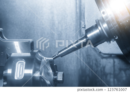 The 5-axis CNC milling machine  cutting the automotive part with solid ball end mill tool in the light blue scene. 123761007