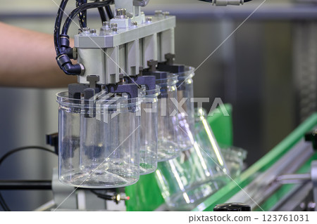 The high technology material handling process from injection machine by robotic system. The high technology material handling process from injection machine by robotic system. 123761031