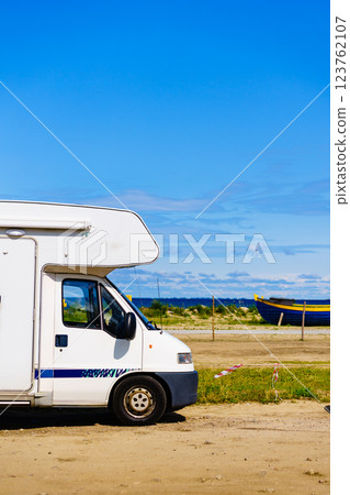 Camper car on sea shore Camper car on sea shore 123762107