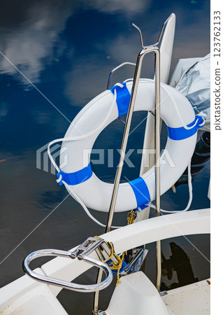 Rescue red lifebuoy life ring on boat 123762133