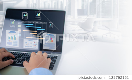 Project management tool and work schedule concept, Businessman use laptop to manager working projects and update task with gantt chart schedule to Business plan and progress, Planning software. Project management tool and work schedule concept, Businessman use laptop to manager working projects and update task with gantt chart schedule to Business plan and progress, Planning software. 123762161