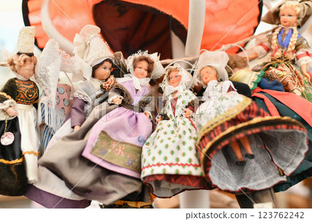 Lots of different Provencal, Breton vintage French dolls at a flea market 123762242