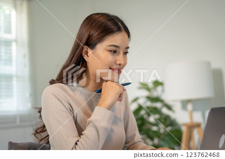 Lovely mom and little young daughter spending time together in their living room. Lovely mom and little young daughter spending time together in their living room. 123762468