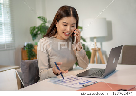 Lovely mom and little young daughter spending time together in their living room. Lovely mom and little young daughter spending time together in their living room. 123762474