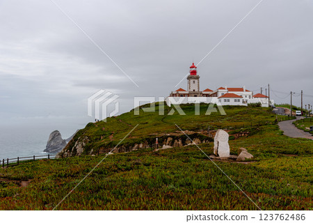 The picturesque lighthouse of Cape Roca stands majestically on the westernmost edge of Europe. The picturesque lighthouse of Cape Roca stands majestically on the westernmost edge of Europe. 123762486