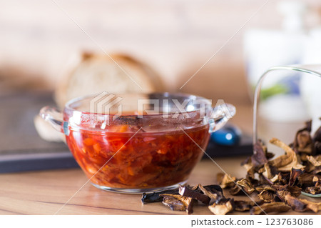 hot lean vegetable soup with beets and dried mushrooms on a wooden table 123763086