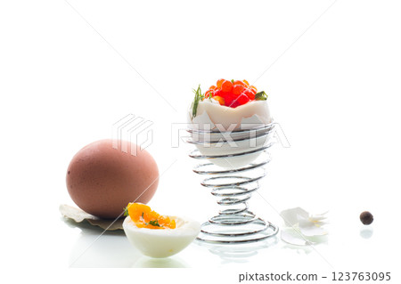 delicacy with red caviar and boiled egg for breakfast, isolated on white background delicacy with red caviar and boiled egg for breakfast, isolated on white background 123763095