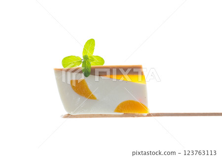 milk fruit jelly with pieces of fruit inside on white background 123763113