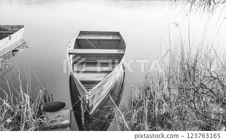 A small boat on the shore of a lake, Barlinek, Poland. A small boat on the shore of a lake, Barlinek, Poland. 123763165