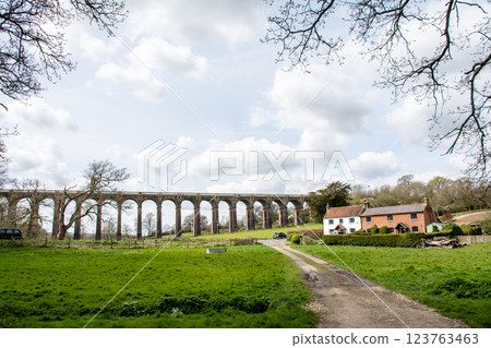 Historic brick viaduct and historic brick houses in the Ouse Valley, a southern suburb of London 123763463