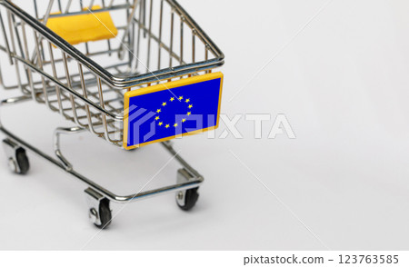 Shopping, VAT and retail in European Union concept. Shopping Cart with EU flag on white background Shopping, VAT and retail in European Union concept. Shopping Cart with EU flag on white background 123763585