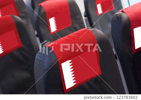 Qatari Flag on Empty seat in plane. Travel, flight and transportration in Qatar concept 123763602