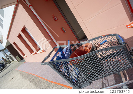 Painting tools and materials in use during a home renovation project on a sunny day at a residential 123763745