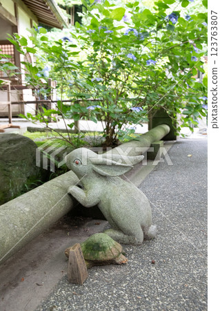 Stone guardian dog with moss Stone guardian dog with moss 123763807