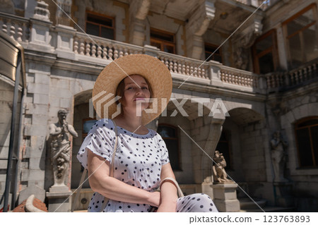 A woman wearing a straw hat A woman wearing a straw hat 123763893