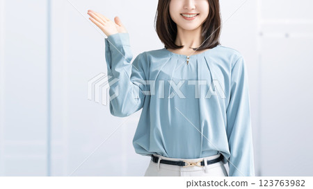 Woman/businesswoman giving directions by hand Woman/businesswoman giving directions by hand 123763982